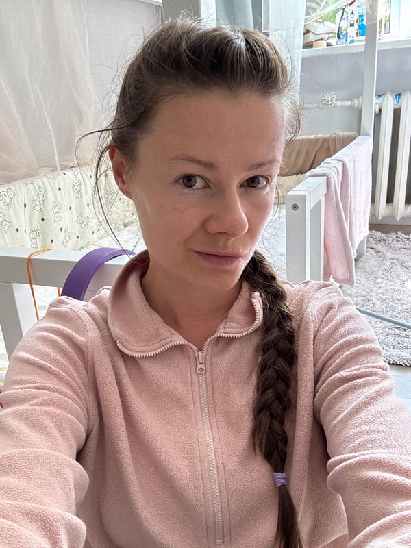 Indoor moment in a Riga home, pink fleece and nursery backdrop