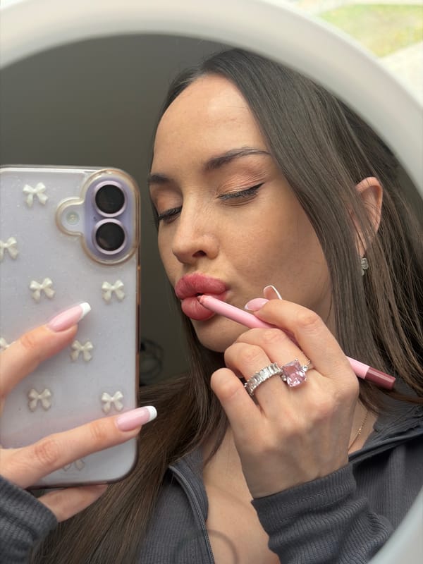 Woman applies makeup, takes mirror selfies in Saint Petersburg