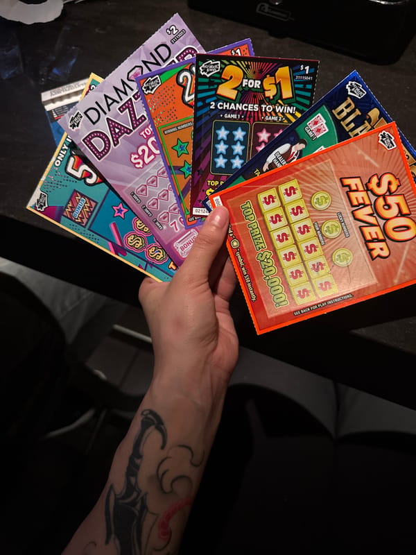Person holds multiple lottery scratch-off tickets in North Vancouver
