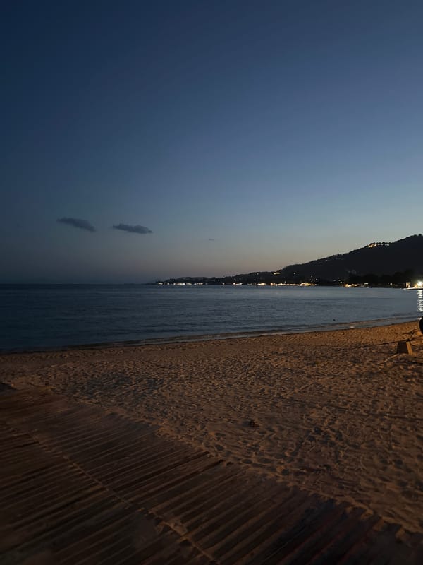 Dusk falls over Ko Samui's beaches, harbor, and lit-up restaurants
