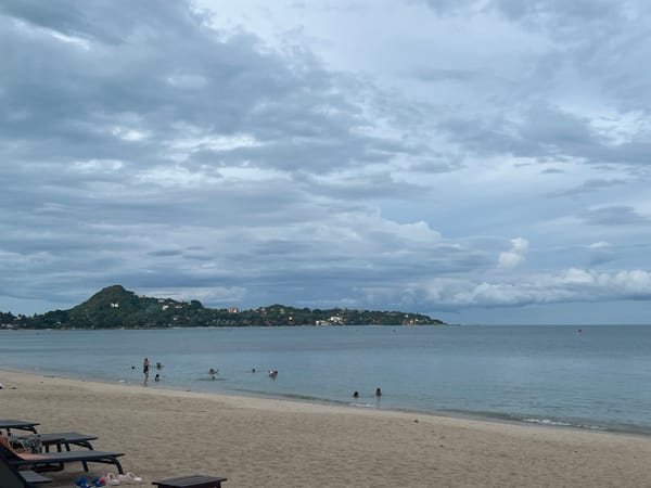 Calm beach day at Baan Lamai under cloudy skies