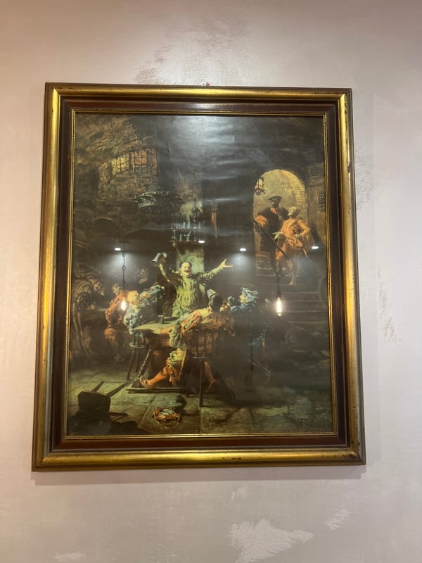 Indoor scenes with historical painting and cat observed