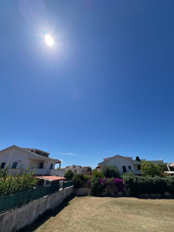 Resident documents sunny afternoon at Bari home terrace