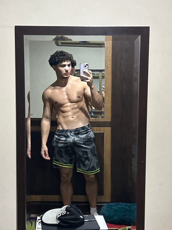 Man takes mirror selfies in Damascus apartment early morning