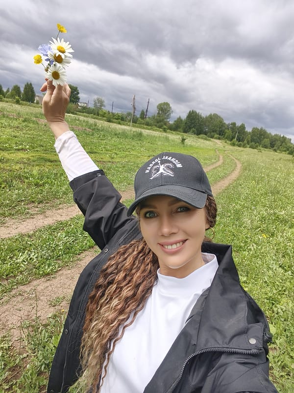 Wildflower picking in a rural Russian field on a cloudy morning