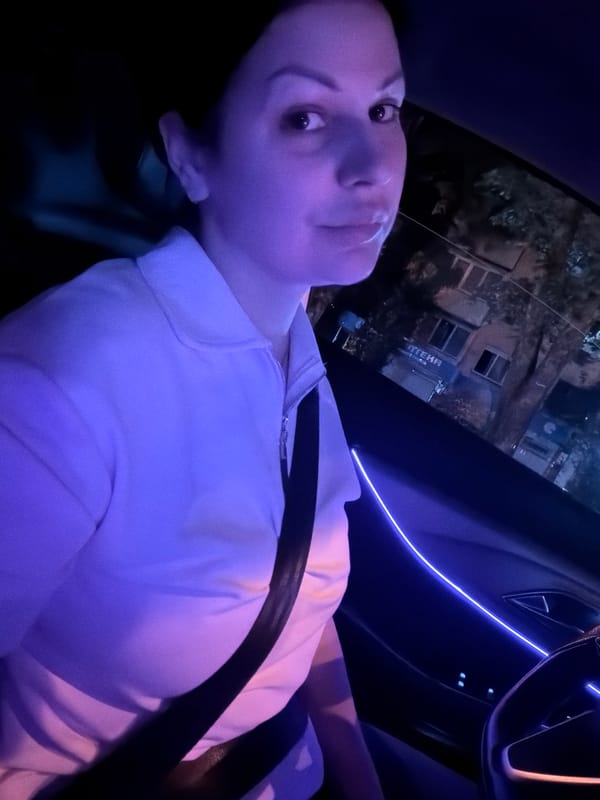 Night ride through Sochi, ambient-lit car interior and city streets.