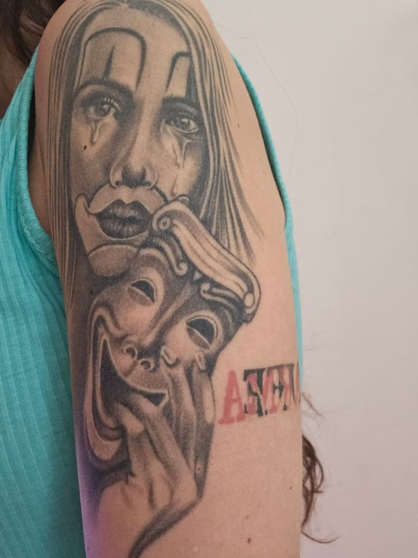Theatrical mask tattoo spotted in Veliko Tarnovo, Bulgaria