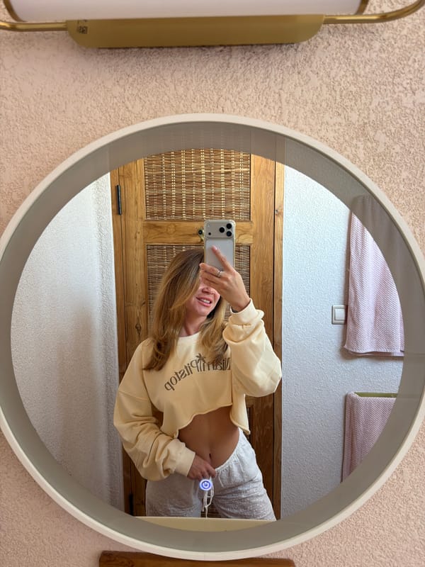 Woman takes mirror selfies in Mengwi, Indonesia bathroom