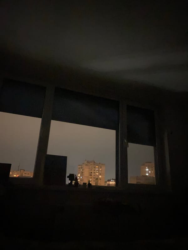 Nighttime city skyline view captured from window in Sofia