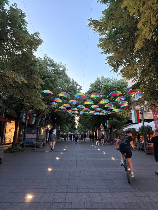 Rainbow umbrellas and city landmarks documented in Burgas, Bulgaria