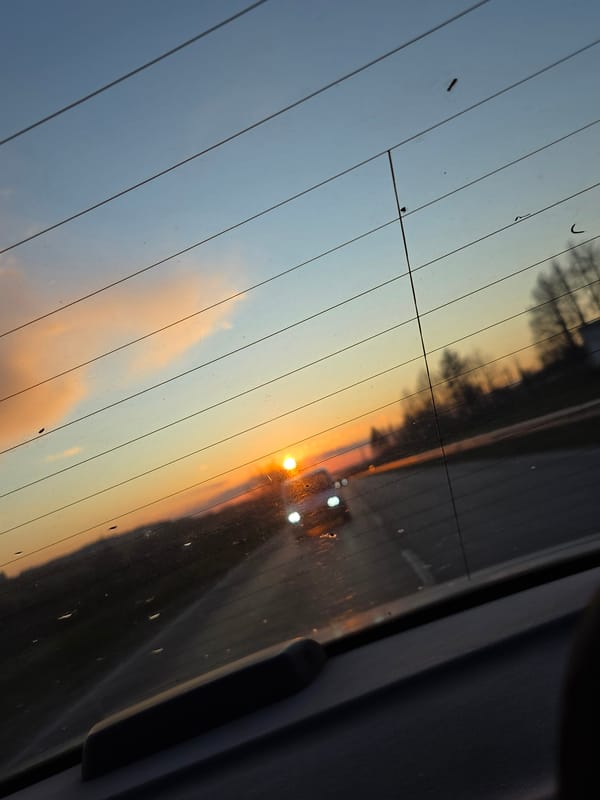 Colorful sunset observed through car window in Pleven, Bulgaria