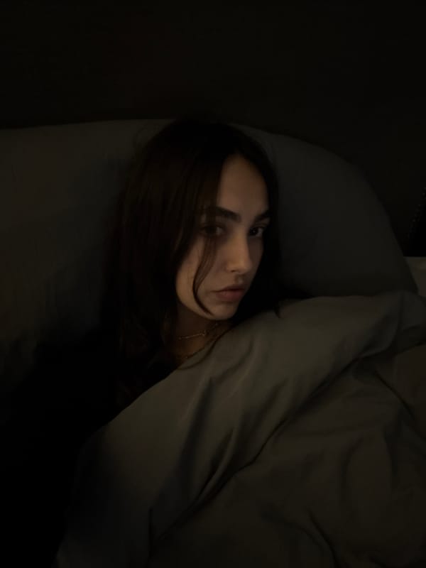 Person photographed in bed in Mexico City morning