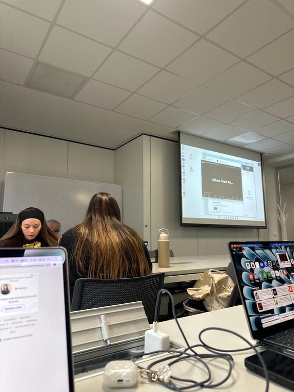 Fashion presentation documented in Milan classroom setting