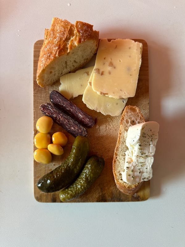 Food arrangement photographed on wooden cutting board in Milan