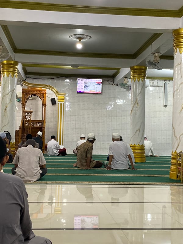 Midday prayers at a mosque in Lhokseumawe, Indonesia