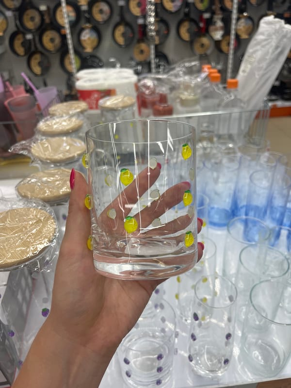 Browsing glassware and woven accessories in a Chelyabinsk shop