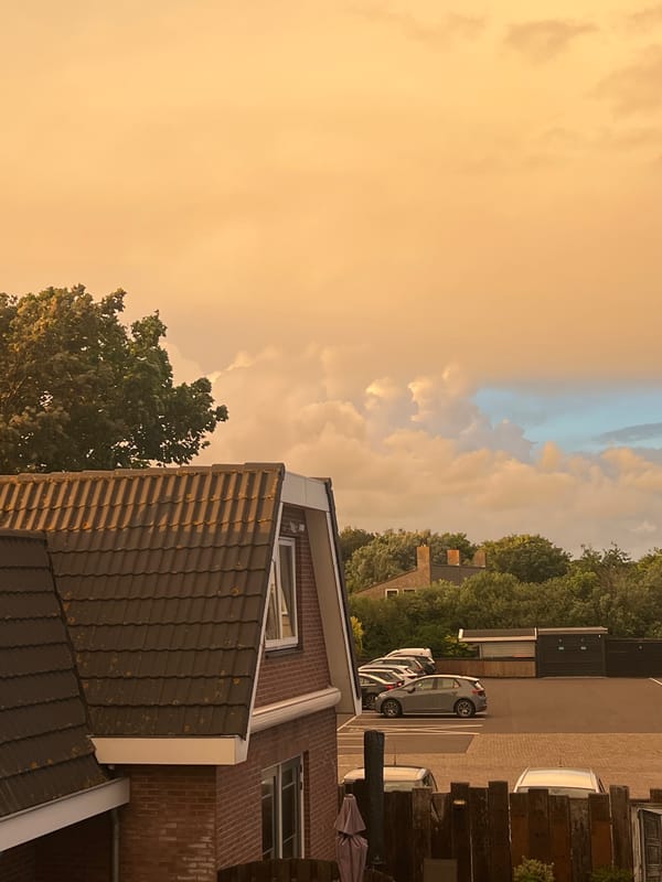 Orange-tinted sky observed over residential Petten, Netherlands