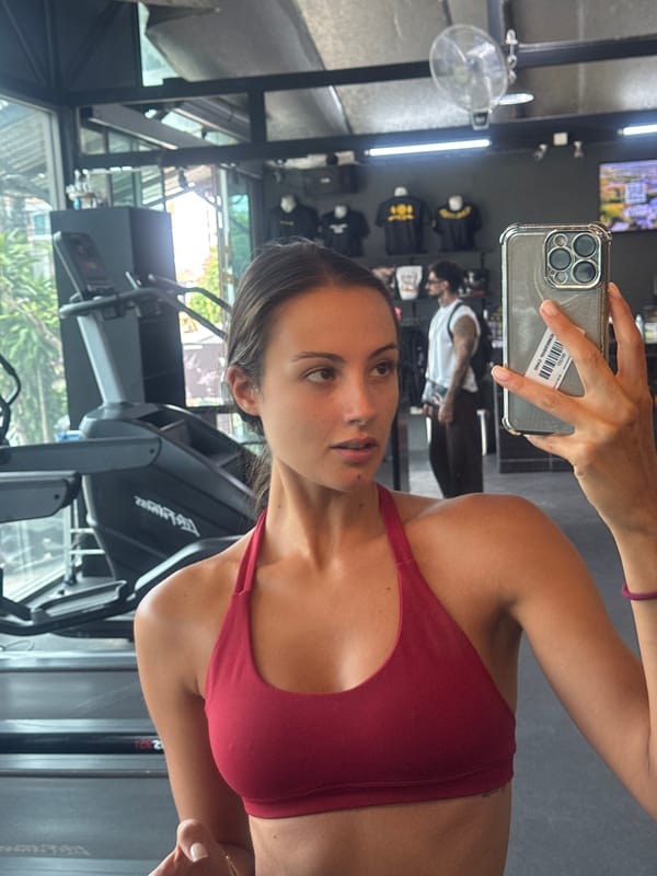 Woman Takes Mirror Selfies at Chalong Gym Early Morning