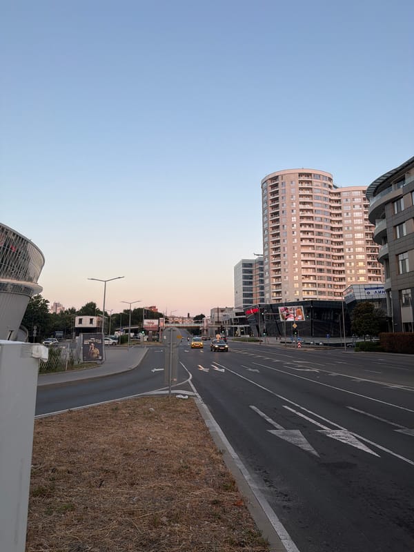 Burgas coastal boulevard at golden hour, traffic flowing both ways