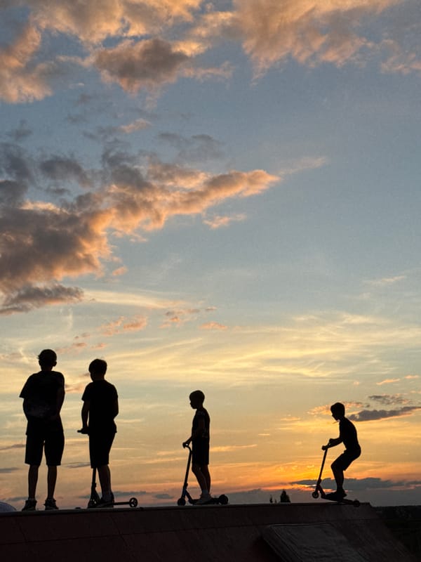 Sunset sessions at a Mikhaylovsk skatepark amid a city under construction