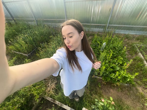 Selfies and roses in a Chaikovsky garden, June afternoon
