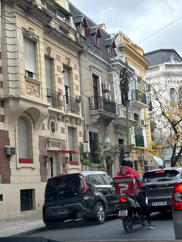 Vehicle travels through Buenos Aires streets capturing everyday traffic scenes