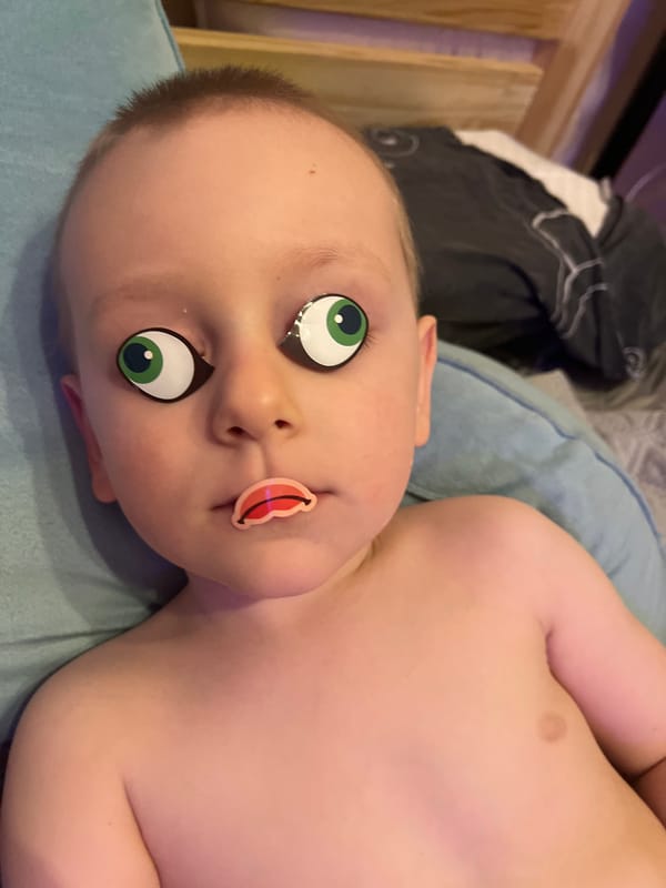 Child plays with toys, wears cartoon stickers in Mytishchi home
