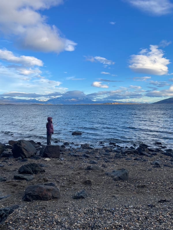 Visitors enjoy scenic waterfront views in Ushuaia, Argentina