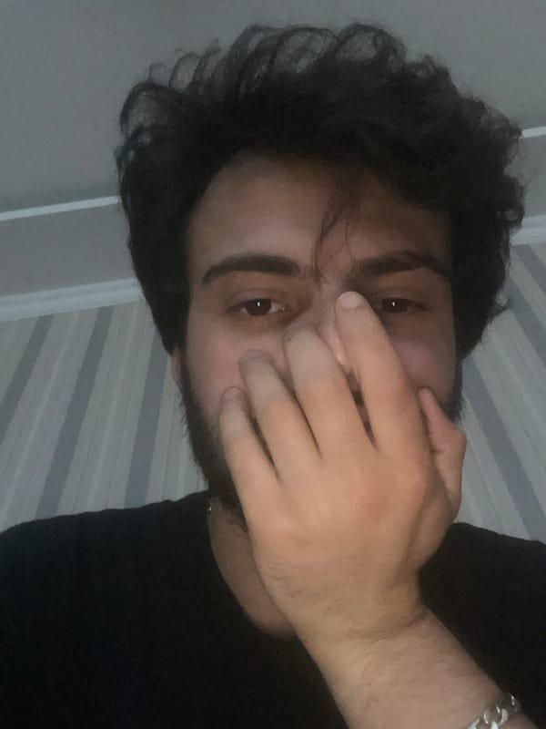 Young man takes multiple selfies in Tbilisi residence
