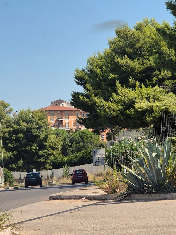 Everyday street activity around Taranto on a summer morning.
