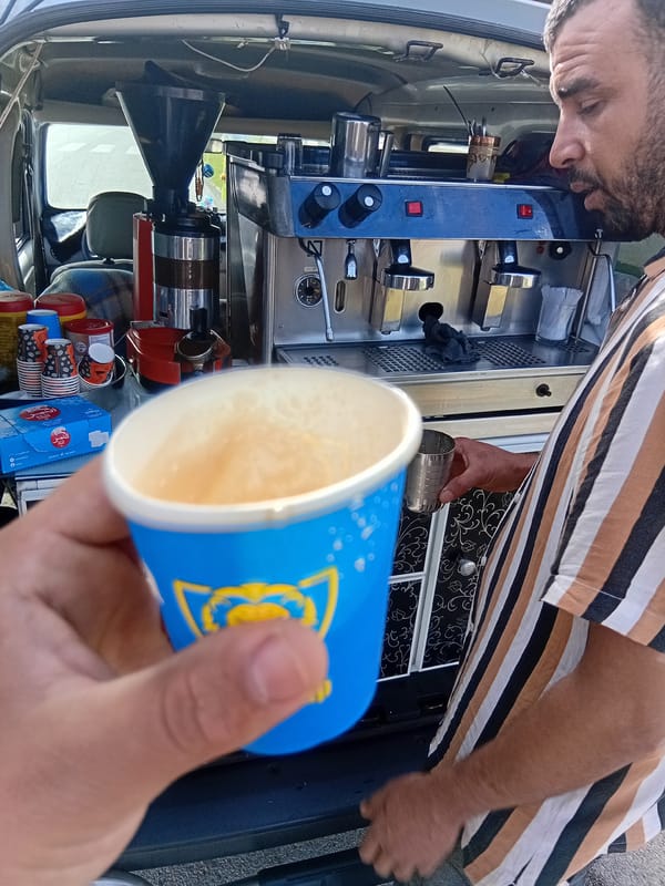 Mobile coffee vendor serves customers from van in Martil