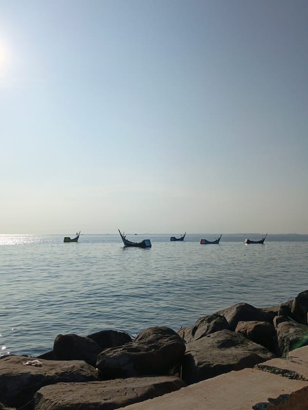 Small boats spotted on calm waters in Lhokseumawe