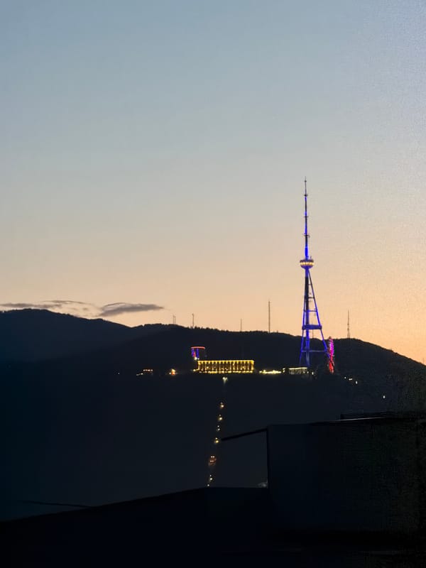 Tbilisi TV Tower Displays Blue-Purple Light Show at Dusk