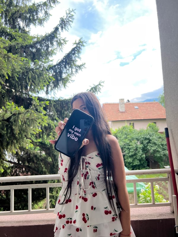 Woman photographs daily life moments from Sofia balcony