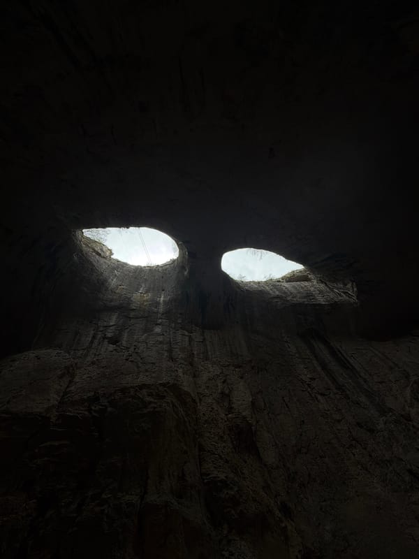 Tourist captures Prohodna Cave's famous ceiling openings in Bulgaria