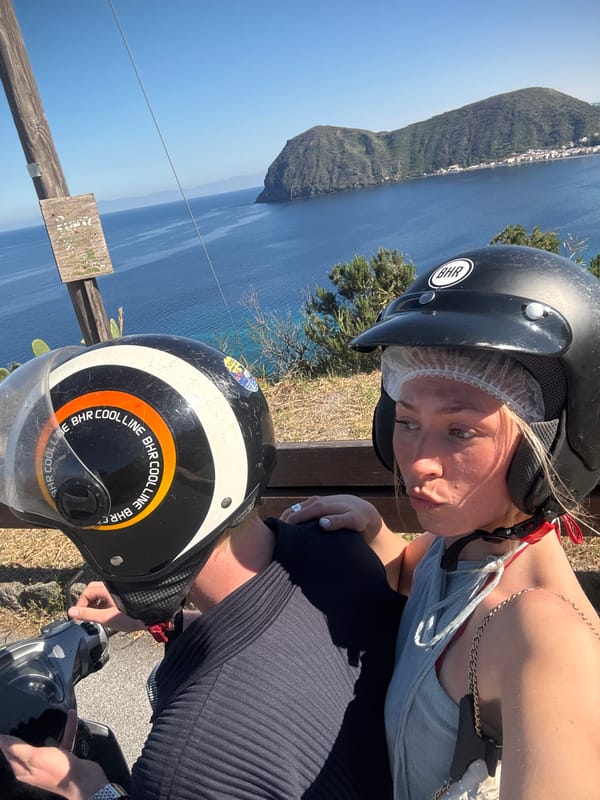Tourists pause for scenic photos during Lipari scooter ride