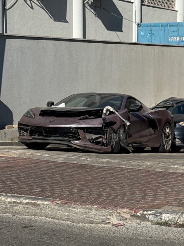 Wrecked Corvette C8 with heavy front-end damage, Petah Tikva