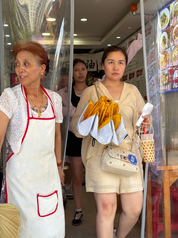 Shapingba street life: Hanfu, food stalls, and wet cobblestones
