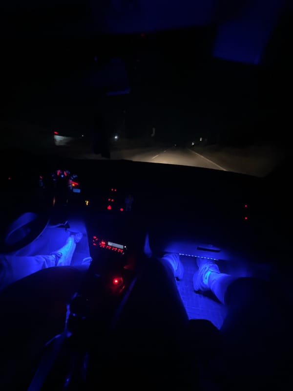 Nighttime car interior captured by passengers in Strazhitsa