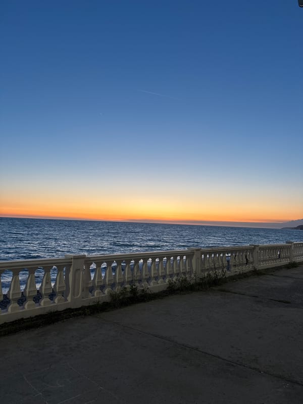 Coastal promenade scene captured during sunset in Sochi, Russia