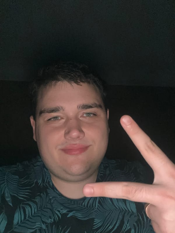 Indoor selfie with a peace sign gesture