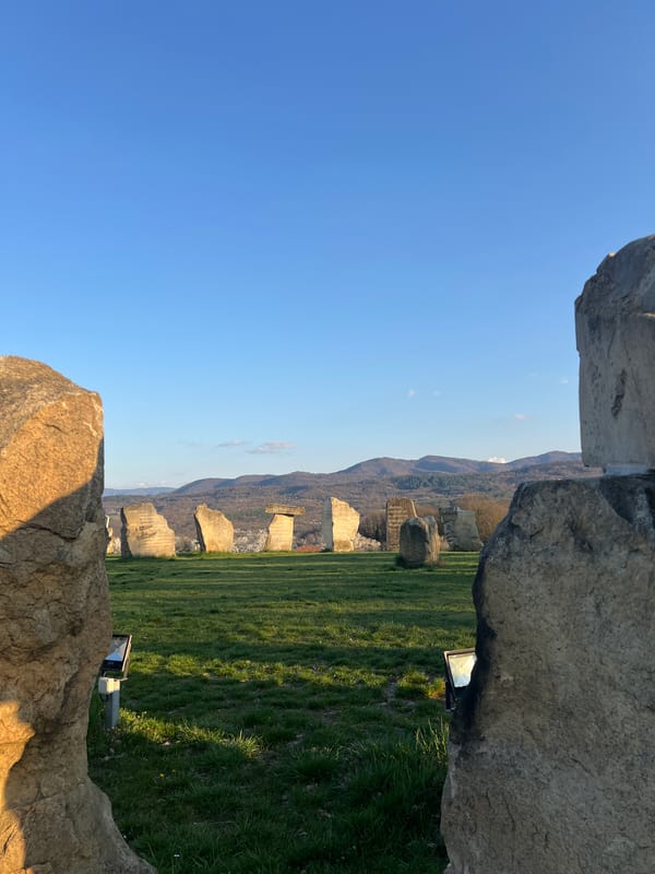 Tourist documents Bulgarian village landmarks and monuments during afternoon visit