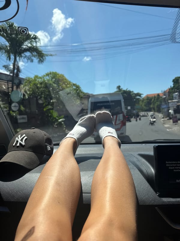 Vehicle passenger view captured in sunny Denpasar