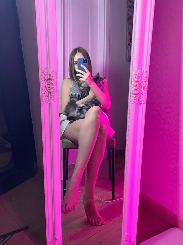 Woman Takes Extended Mirror Selfie Session in Batumi Room