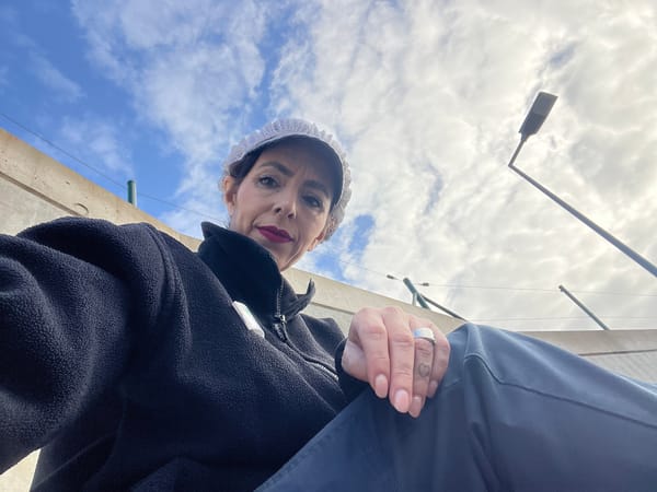 Person in traditional bonnet photographed in Luxembourg village