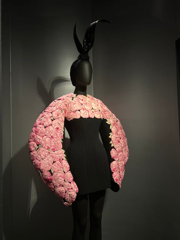 Fashion mannequin observed in black dress display in London