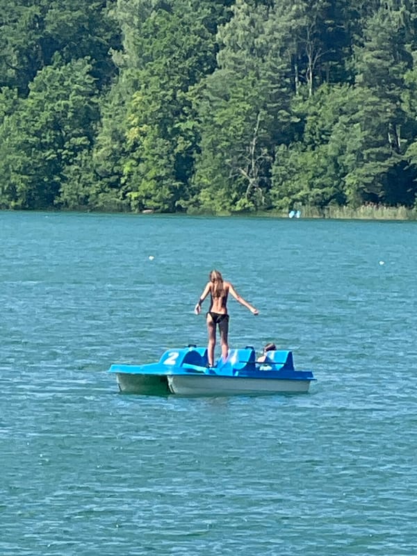 Summer afternoon on Vilnius lakes: paddleboards, pedal boats, sunny docks