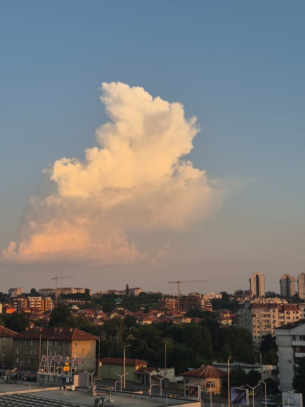 Balcony selfies and sunset city views from a high-rise evening