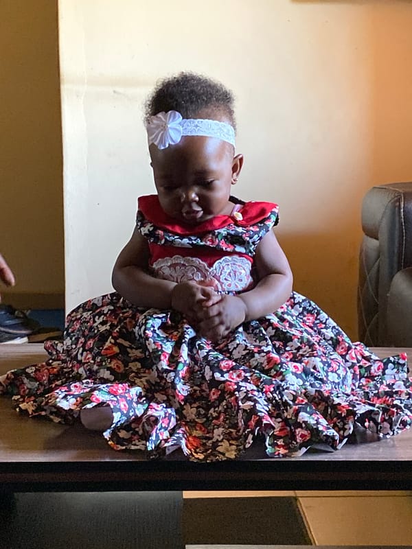 Baby girl plays at home in Bukuru, Nigeria