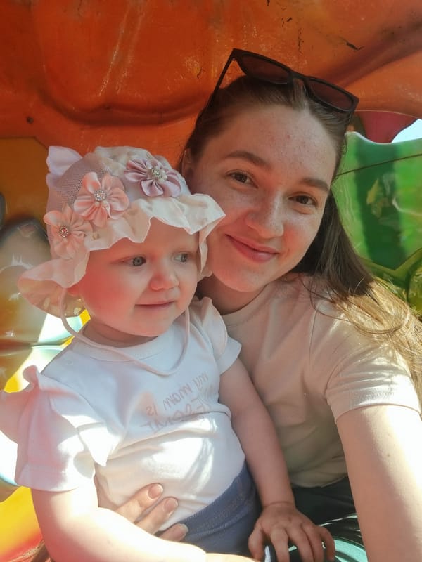 Woman and baby girl photographed together at unknown location